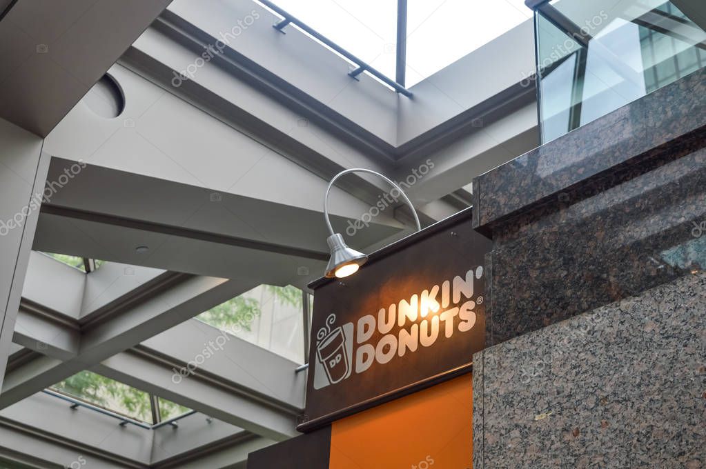 Montreal, Canada - January 29, 2017: Dunkin' Donuts shop. Founded in 1950, Dunkin' Donuts is an American global donut company and coffeehouse chain with more than 10,000 locations in 32 countries