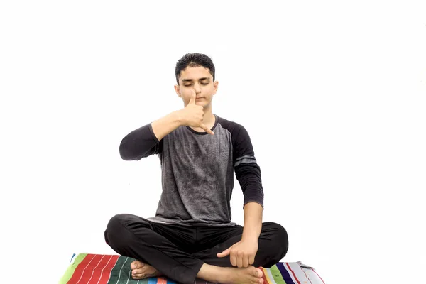 Full Body Shot Male Teenager Doing Nadi Shdhana Pranayama Alternate — Stockfoto