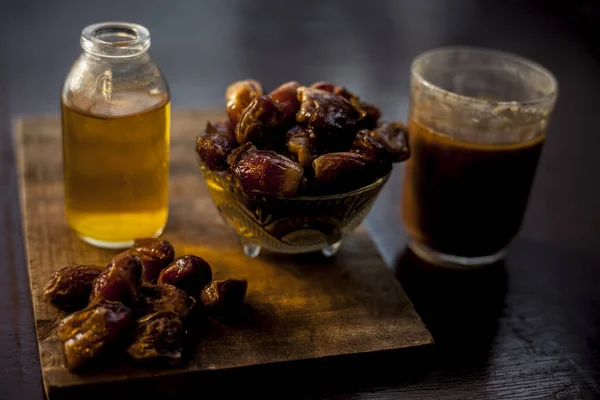 Dates Syrup Glass Some Raw Dried Dates Some Cooking Oil — Stock Photo, Image