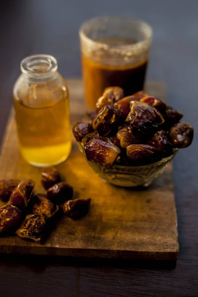 Dates Syrup Glass Some Raw Dried Dates Some Cooking Oil — Stock Photo, Image