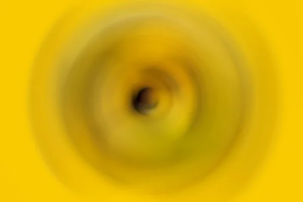The black ripple effect in the yellow-colored solid background.