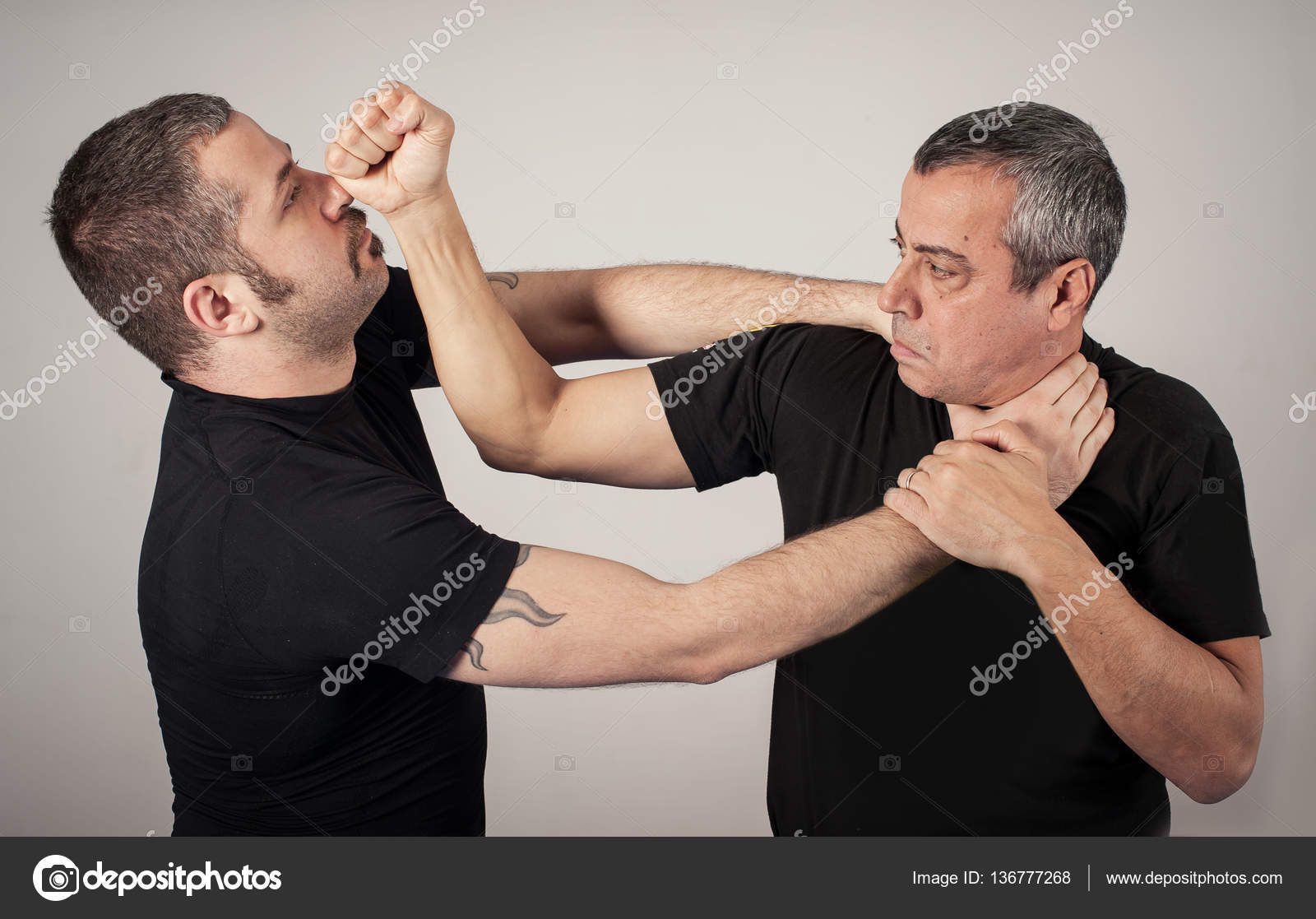 Street fighting self defense technique against holds and grabs Stock