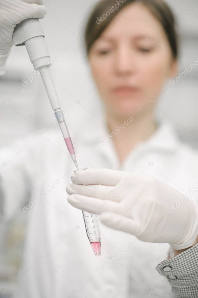 Medical laboratory scientists in the laboratory filling test tub