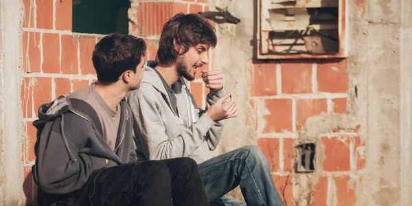 Man lick cannabis joint to try make them last longer — Stock Photo, Image