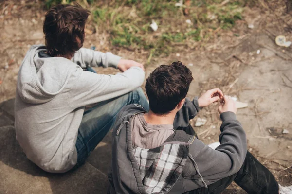 Two depressed and sad young buddies friends thinking about probl — Stock Photo, Image