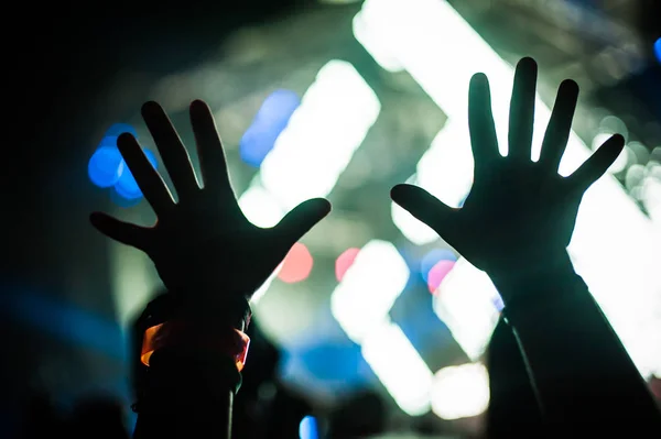 Silhouette of raised hands and arms at concert festival party — Stock Photo, Image