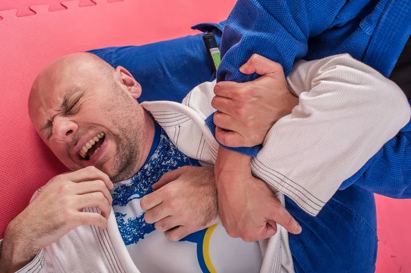 Brazil jiu jitsu edzés. Ágyas és földi lock technika — Stock Fotó