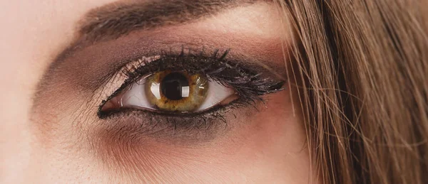 Close up of beautiful woman face portrait with tinsel makeup