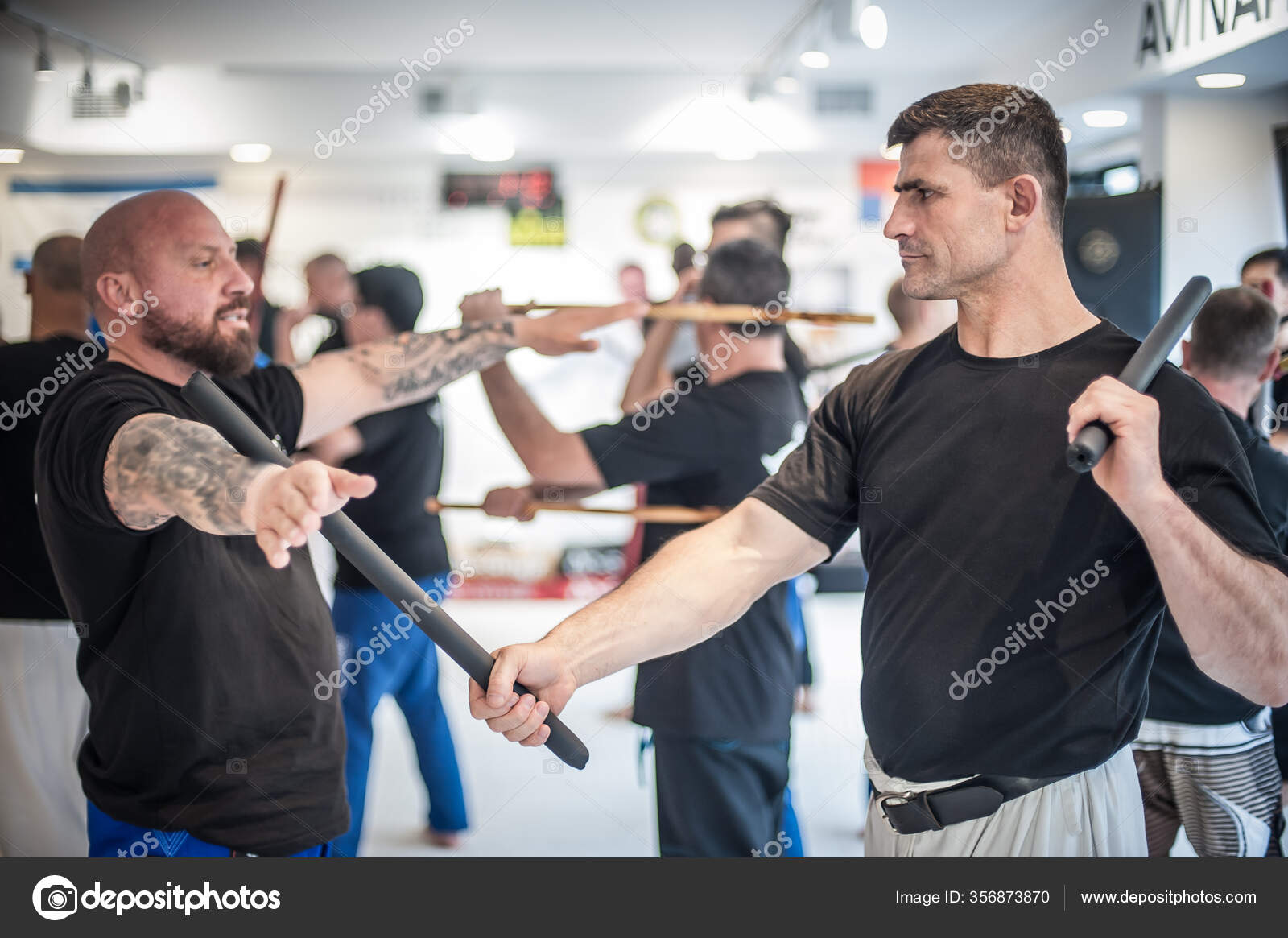 Large Group Students Practice Filipino Eskrima Arnis Stick Fight Techniques  Stock Photo by ©guruxox 356873870