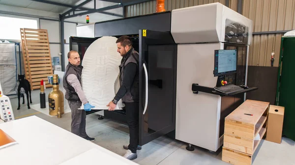 Two Technicians Wear Huge Model Sneaker Printed Large Modern Printer — Stock Photo, Image