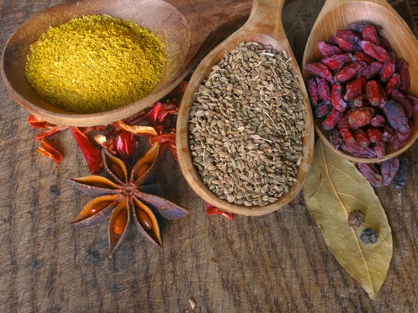 Dry spices on the wooden board — Stock Photo, Image