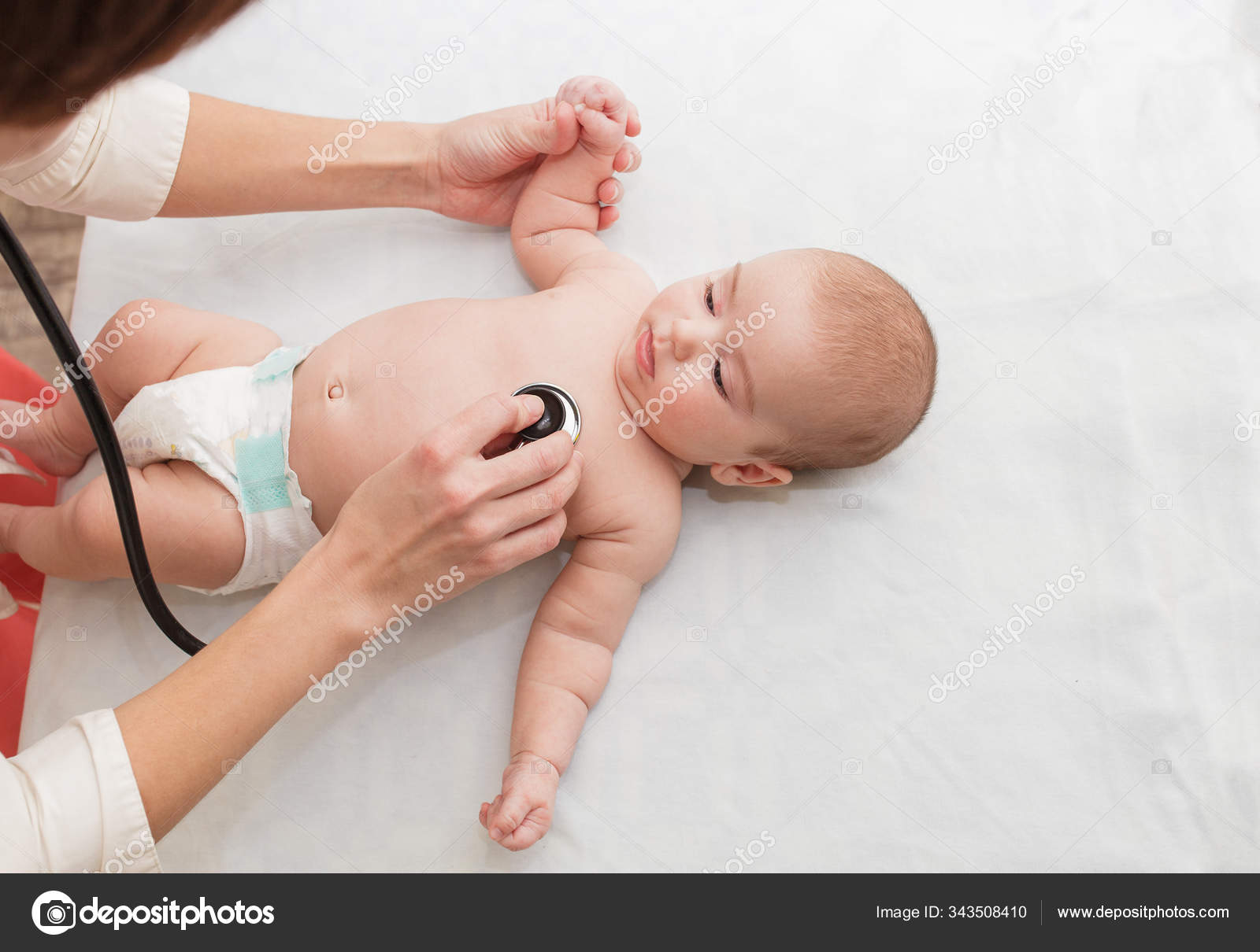 Premium Photo  Shot of a pediatrician examining newborn baby