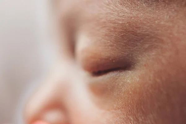 Newborn baby's face close up: eyes, nose, lips. concept of childhood, health care, IVF, hygiene, ENT — Stock Photo, Image