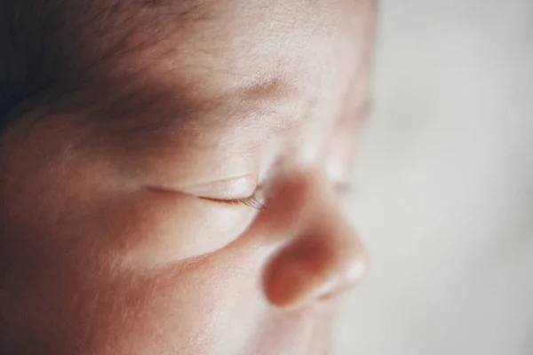 Newborn baby's face close up: eyes, nose, lips. concept of childhood, health care, IVF, hygiene, ENT — Stock Photo, Image