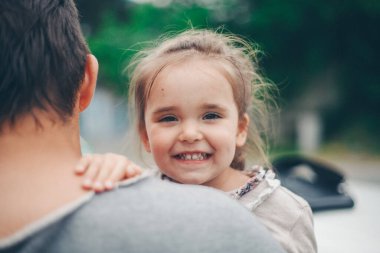 Dad holds the child in his arms. The concept of educating the father of young children, Happy childhood, a friendly family.