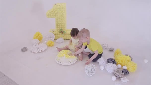 Birthday Celebration Boy Little Girl Eating Cake Hands White Background — Stockvideo