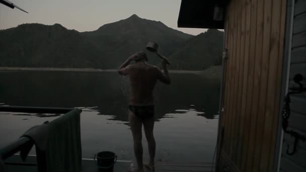 Wet Man Stands Lake Guy Watering Himself Bucket Cold Water — Stock Video