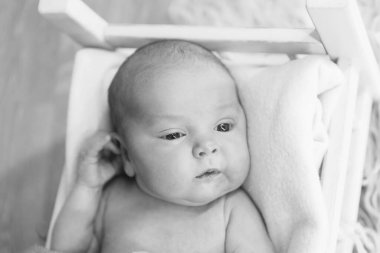 portrait of a little girl: baby's face with hand near the face close-up. concept of childhood, healthcare, IVF