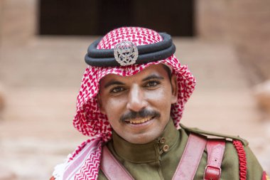 PETRA, JORDAN - December 25th, 2015: Royal soldier guarding the city's stone security clipart