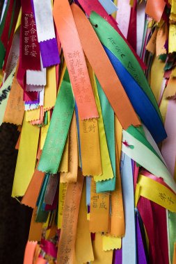 PENANG, MALAYSIA, DECEMBER 19 2017: Wish ribbons in chinese buddhist Kek lok Si temple clipart