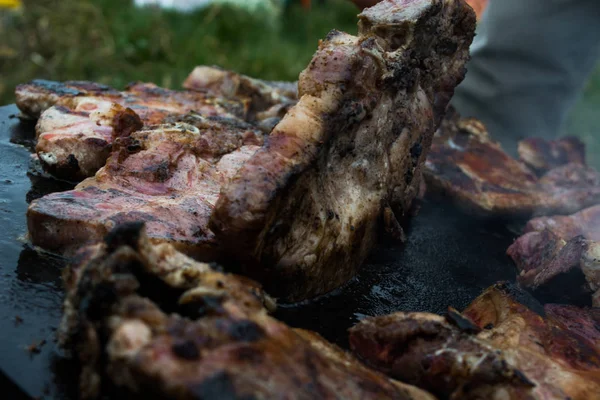 Grilling meat on wood stove — Stock Photo, Image