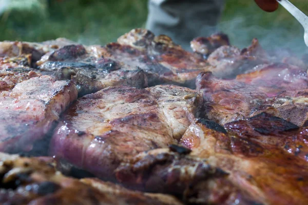 Grilling meat on wood stove — Stock Photo, Image