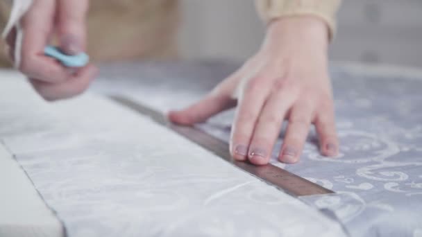 Close-up of the hands of a seamstress. On fabric coated cutting line — Stock Video