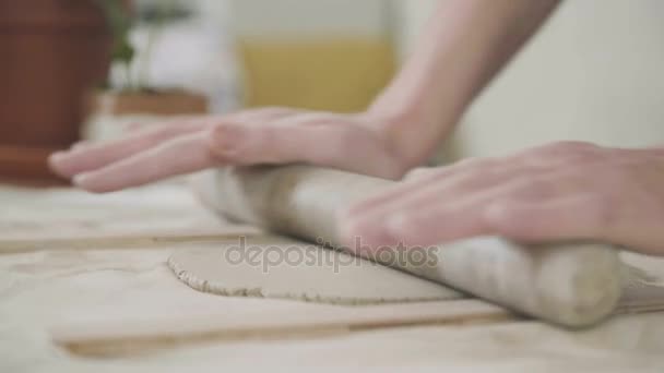 Freelance working concept. Woman rolls ceramist clay special too — Stock Video