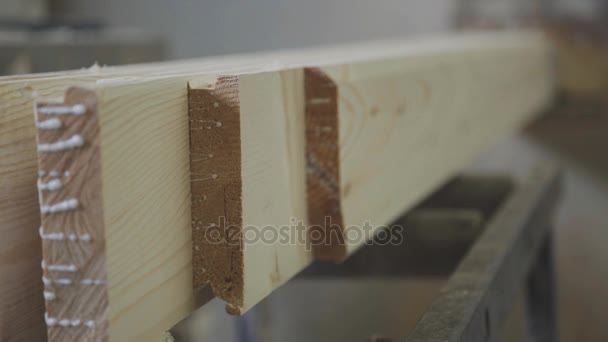 Slats out from under the machine. Wooden sawdust. — Stock Video