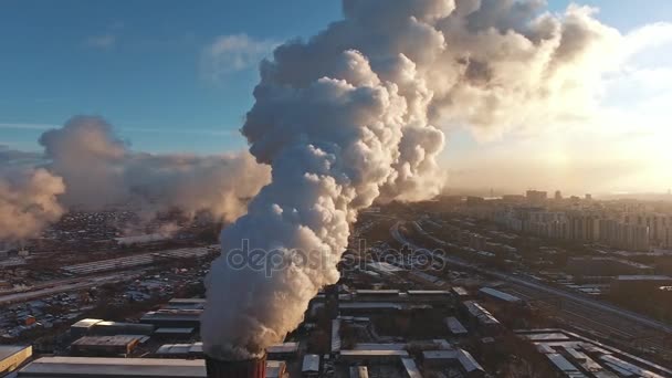 Industrial zone with a large red and white pipe, aerial view — Stock Video