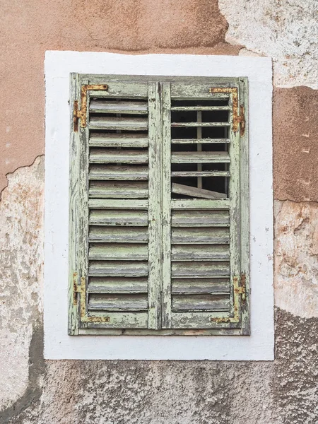 Window with green window shutter