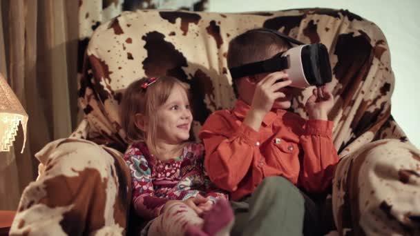 Kids looking through VR headset and gesticulating — Stock Video