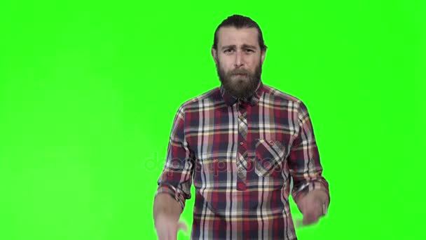 Young bewildered man in checkered shirt — Stock Video