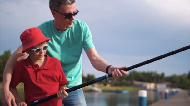 Boy learning How to fish — Stock Video