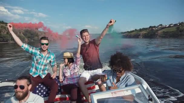 People on boat with colored smoke — Stock Video
