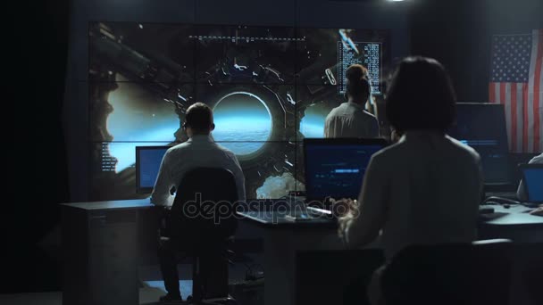 People working in mission control center — Stock Video