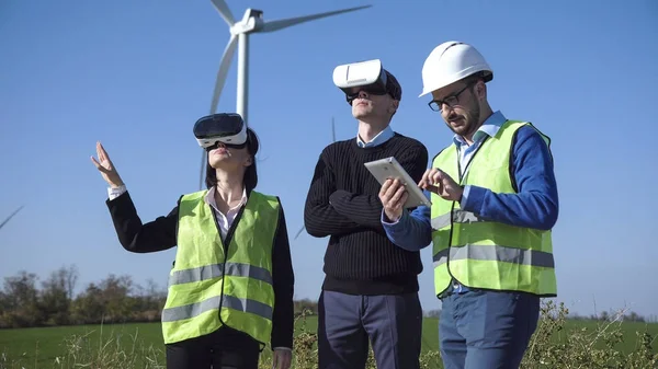 Engineers with virtual reality headset
