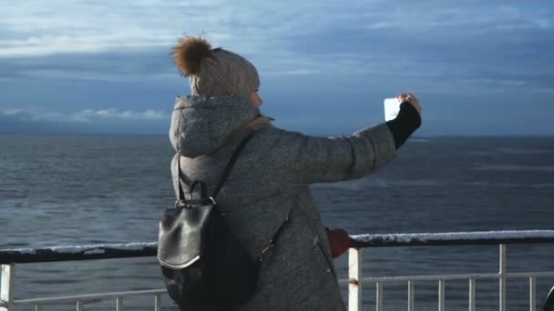 Woman taking selfie on cold ship — Stock Video