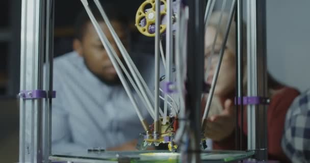 Scientists watching 3d printing work — Stock Video