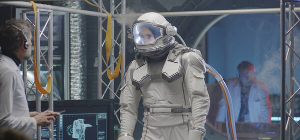 Astronaut walking on a treadmill