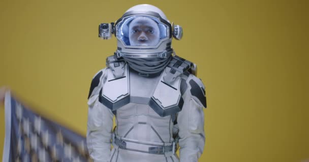 Man showing thumbs up in space suit — Stock Video