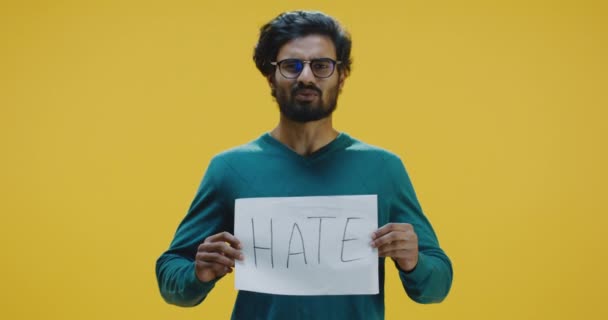 Young man holding hate sign and talking — 비디오