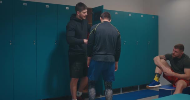 Fist fighting in locker room — Stock Video