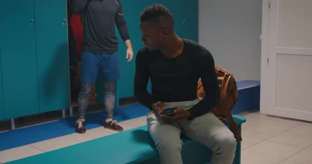 Men having fun in locker room — Stock Video