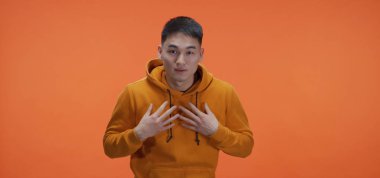 Young man politely avoiding