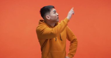 Young man searching and pointing