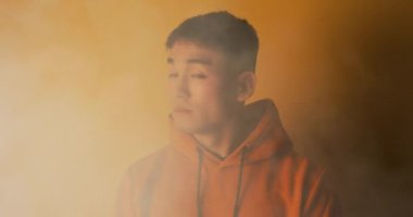 Young man turning on torch