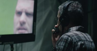 Director watching a scene on monitor