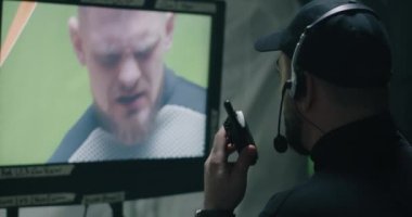 Director watching a scene on monitor