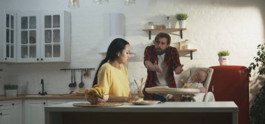 Parents with baby having argument